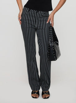 side view of model wearing Princess Polly Allude Low Waist Pinstripe Pant Black Low Rise Pants Pants 