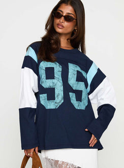 side view of model wearing Princess Polly Collegiate Queen Long Sleeved Top Navy Full Sleeves Crew Neck 