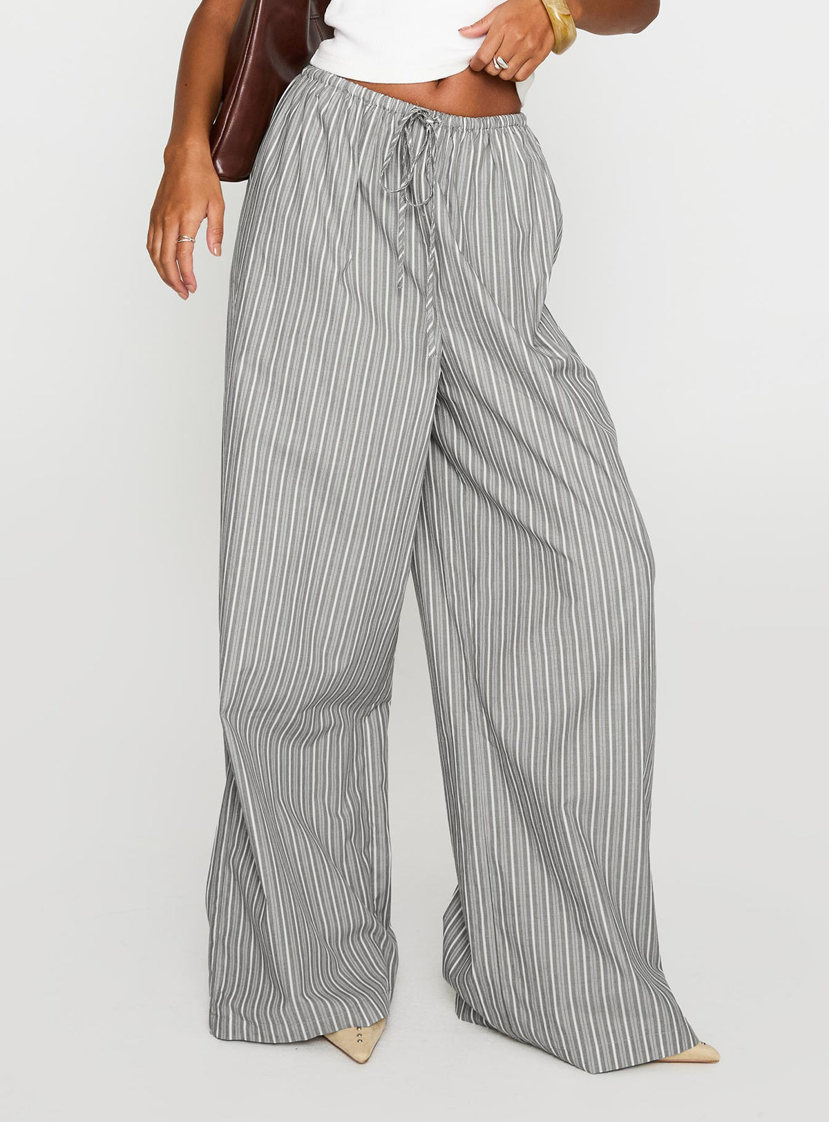 side view of model wearing Princess Polly Lucea Pants Multi High Waisted Pants 