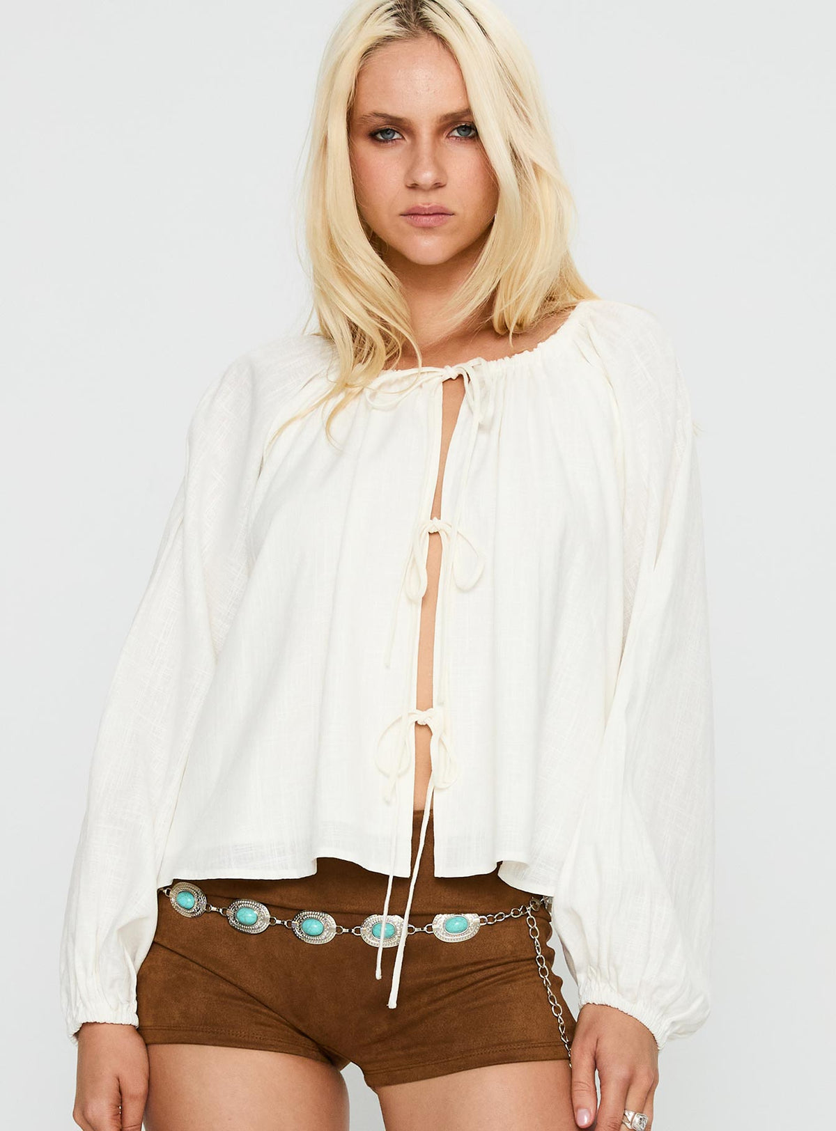 front view of model wearing Princess Polly Somebody Else Tie Up Top White Full Sleeves Crew Neck 