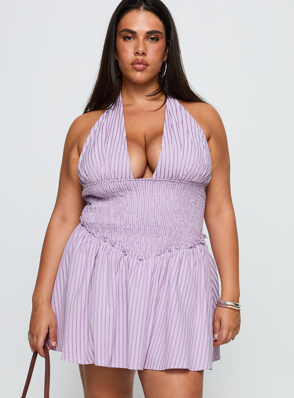 front view of model wearing Princess Polly Attracted Halter Mini Dress Purple Stripe Curve Plunger 
