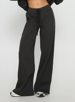 side view of model wearing Princess Polly Princess Polly Stargirl Wide Leg Sweat Pants Charcoal High Rise Pants Pants 
