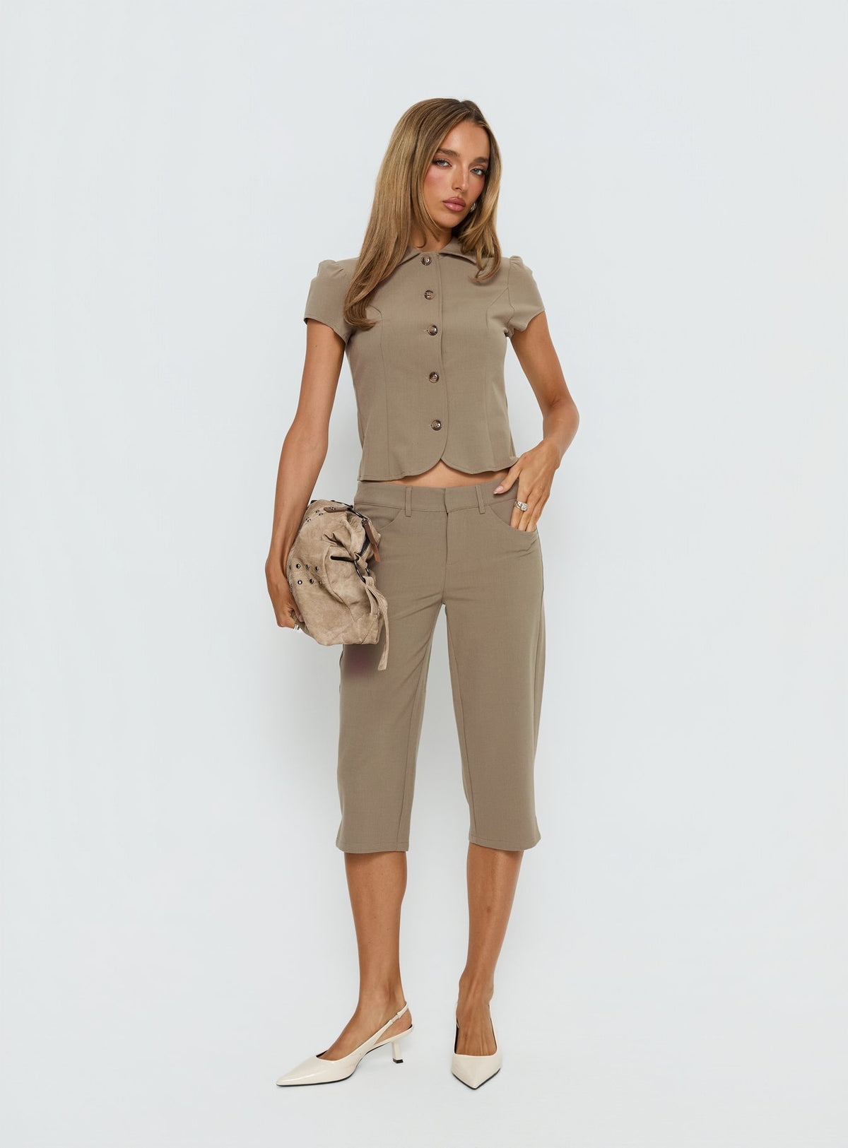 front view of model wearing Princess Polly Tunian Capri Tailored Pants Taupe Mid Rise Pants Pants 