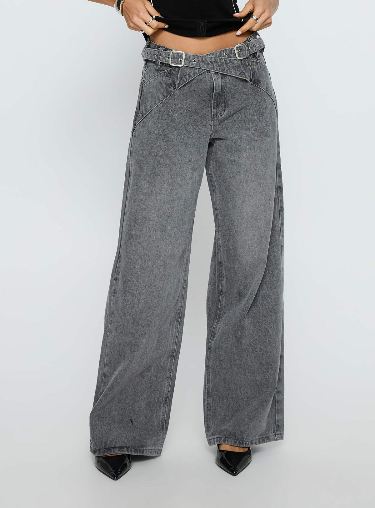 side view of model wearing Princess Polly Mckinley Mid Rise Wide Leg Jeans Washed Grey Mid Rise Jeans 