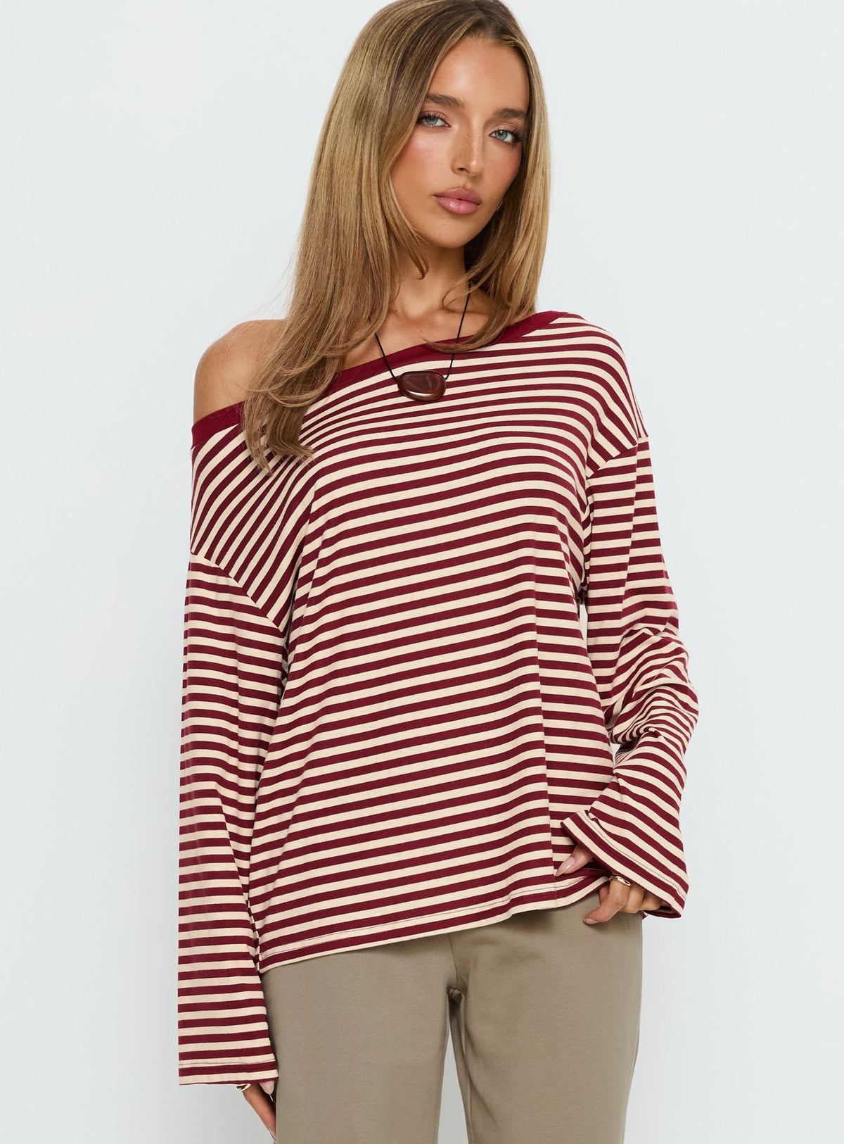 back view of model wearing Princess Polly Ralyssa Off Shoulder Long Sleeve Top Red Stripe Longline Jumpers Jumpers 