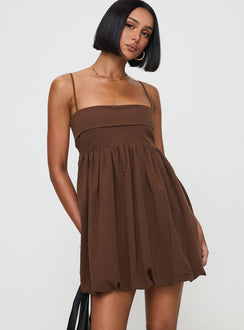 side view of model wearing Princess Polly Layken Bubble Hem Mini Dress Chocolate Petite Square Neck 