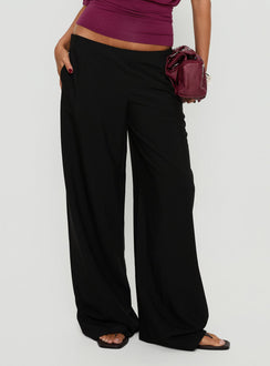 Crafted from the Khane Low Rise Wide Leg Pant Black Petite in womens-regular-pants detail view of model wearing