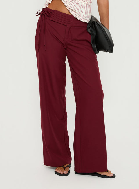 side view of model wearing Princess Polly Good Riddance Pleat Tie Slouch Pants Burgundy Mid Rise Pants Pants 