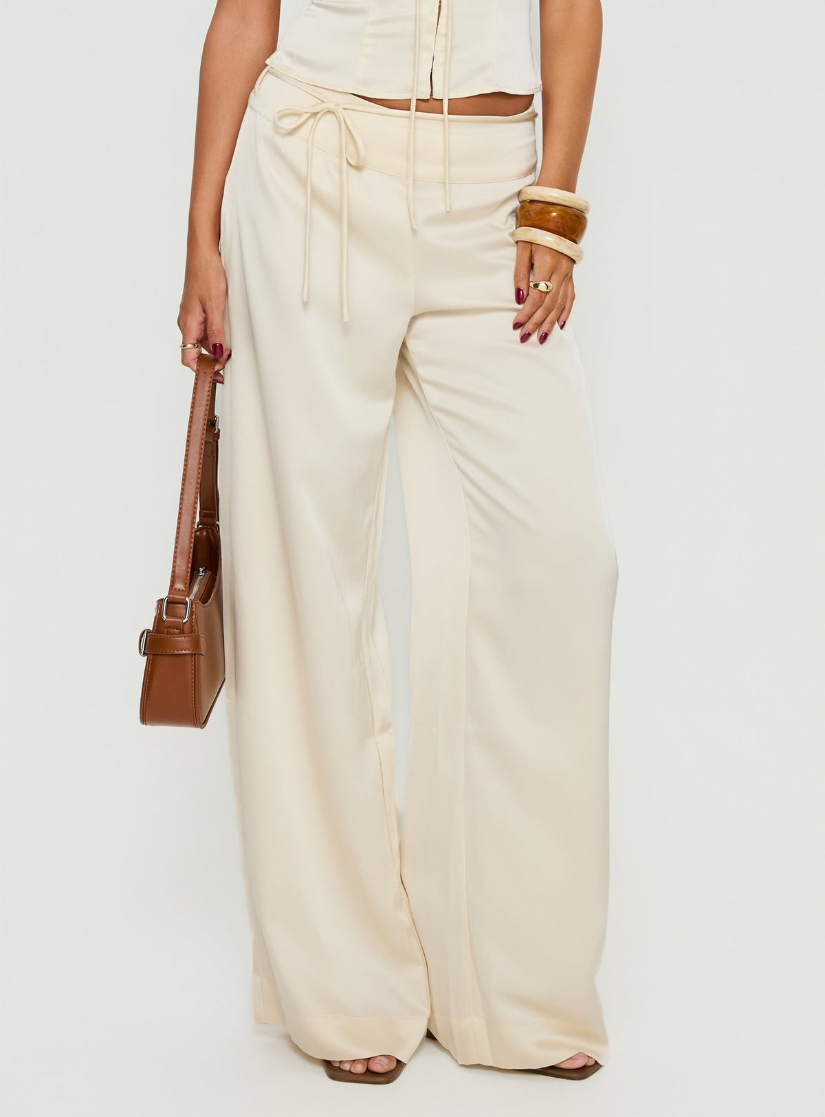 front view of model wearing Princess Polly Aubrette Satin Tie Pants Cream High Rise Pants 