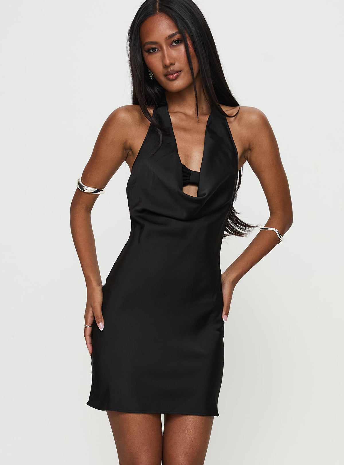side view of model wearing Princess Polly Tempeste Halter Mini Dress Black Cowl Neck 