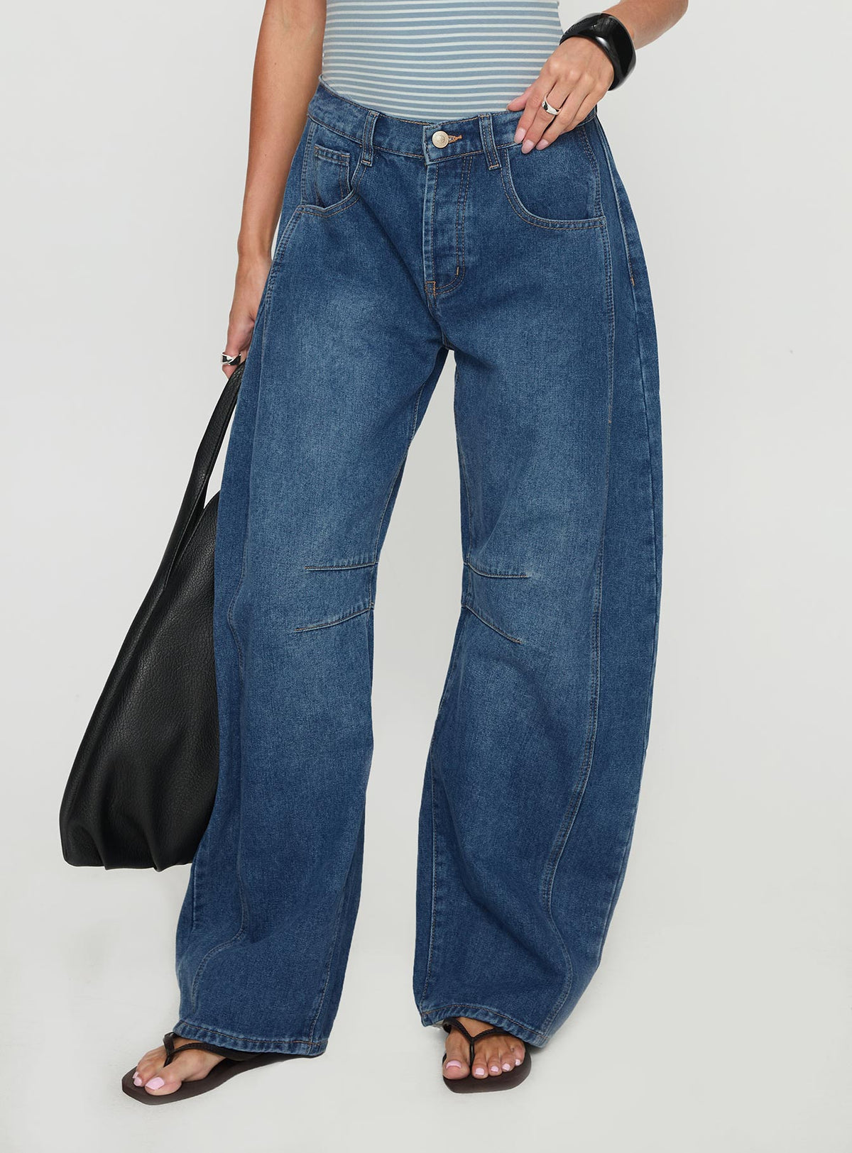 back view of model wearing Princess Polly Normana Mid Rise Cropped Barrel Jeans Mid Blue Wash Mid Rise Jeans 
