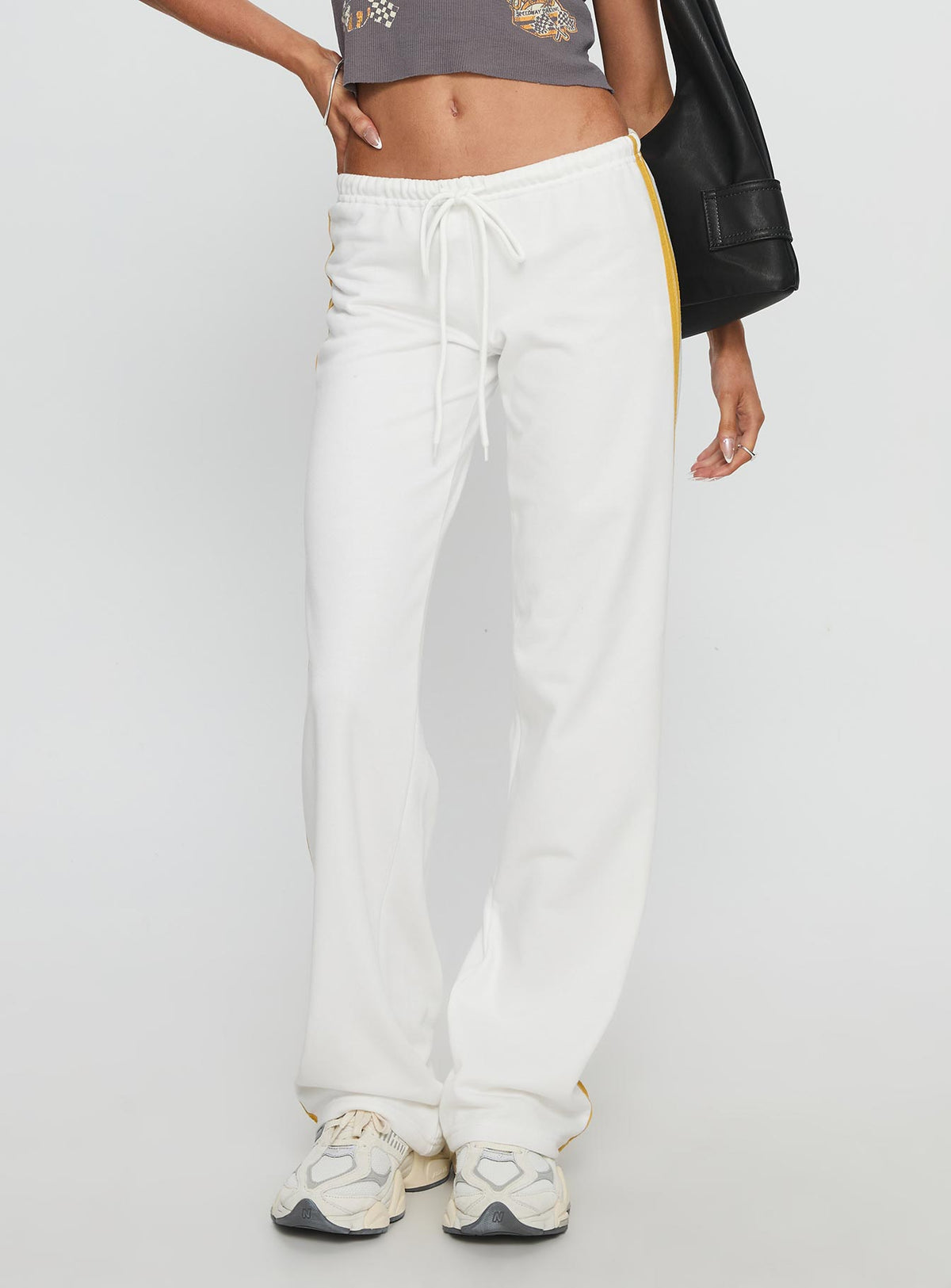 back view of model wearing Princess Polly Elation Low Rise Straight Leg Track Pant White Low Rise Pants Pants 