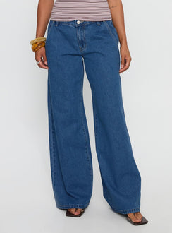 front view of model wearing Princess Polly Polaris Mid Rise Straight Leg Jeans Mid Blue Mid Rise Jeans Jeans 