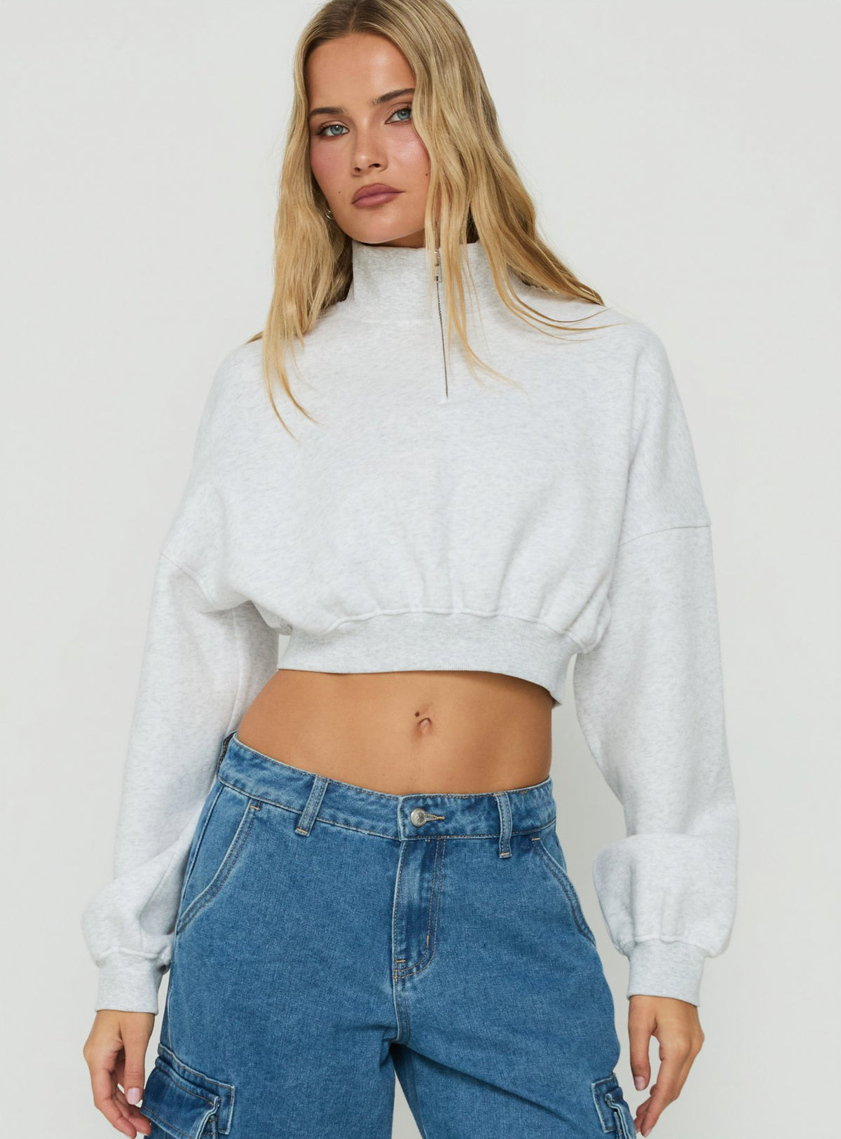 Featuring the Astridd 3/4 Zip Cropped Jumper Grey Marle womens jumper with short length detail view of model wearing Princess Polly