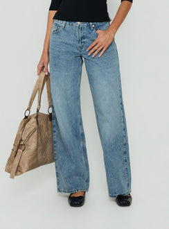 Featuring Serenitia Mid Rise Relaxed Jeans in Bright Blue womens-jeans with mid-rise waist detail view of model wearing
