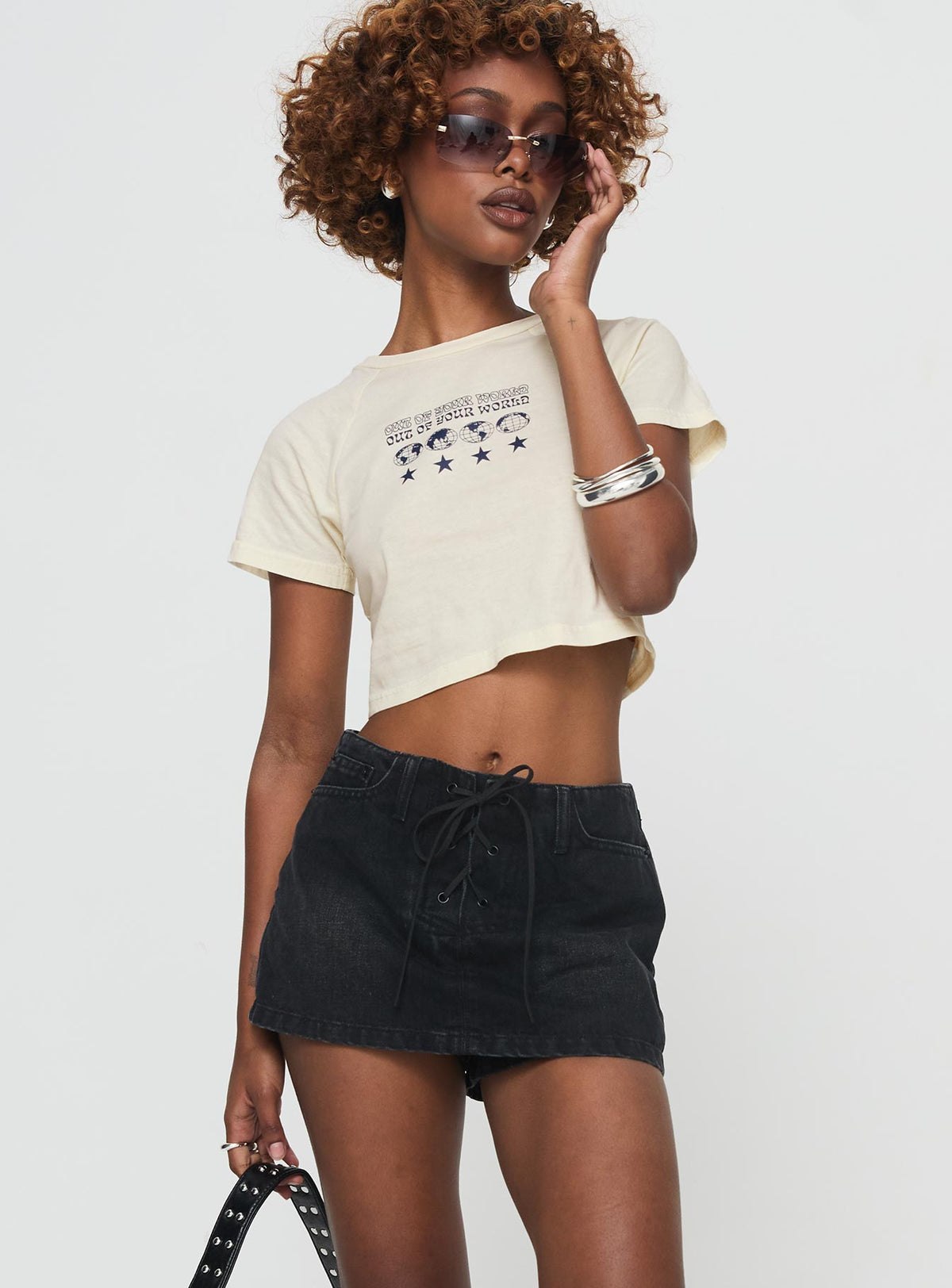 front view of model wearing Princess Polly Amethysta Denim Skort Black Low Rise Shorts 