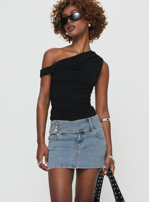   side view of model wearing Princess Polly Brinkman Mini Skirt Light Wash Denim Mini Skirts Skirts 