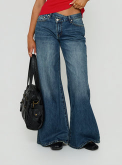 Featuring Celinia Mid Rise Asymmetrical Baggy Jeans Dark Indigo womens-jeans with mid-rise detail view Princess Polly