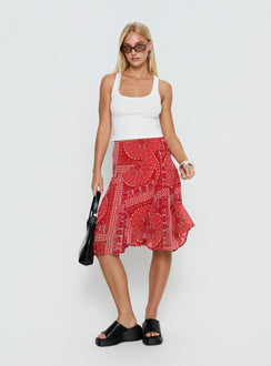   side view of model wearing Princess Polly Raenah Asymmetrical Midi Skirt Red Paisley Skirts 