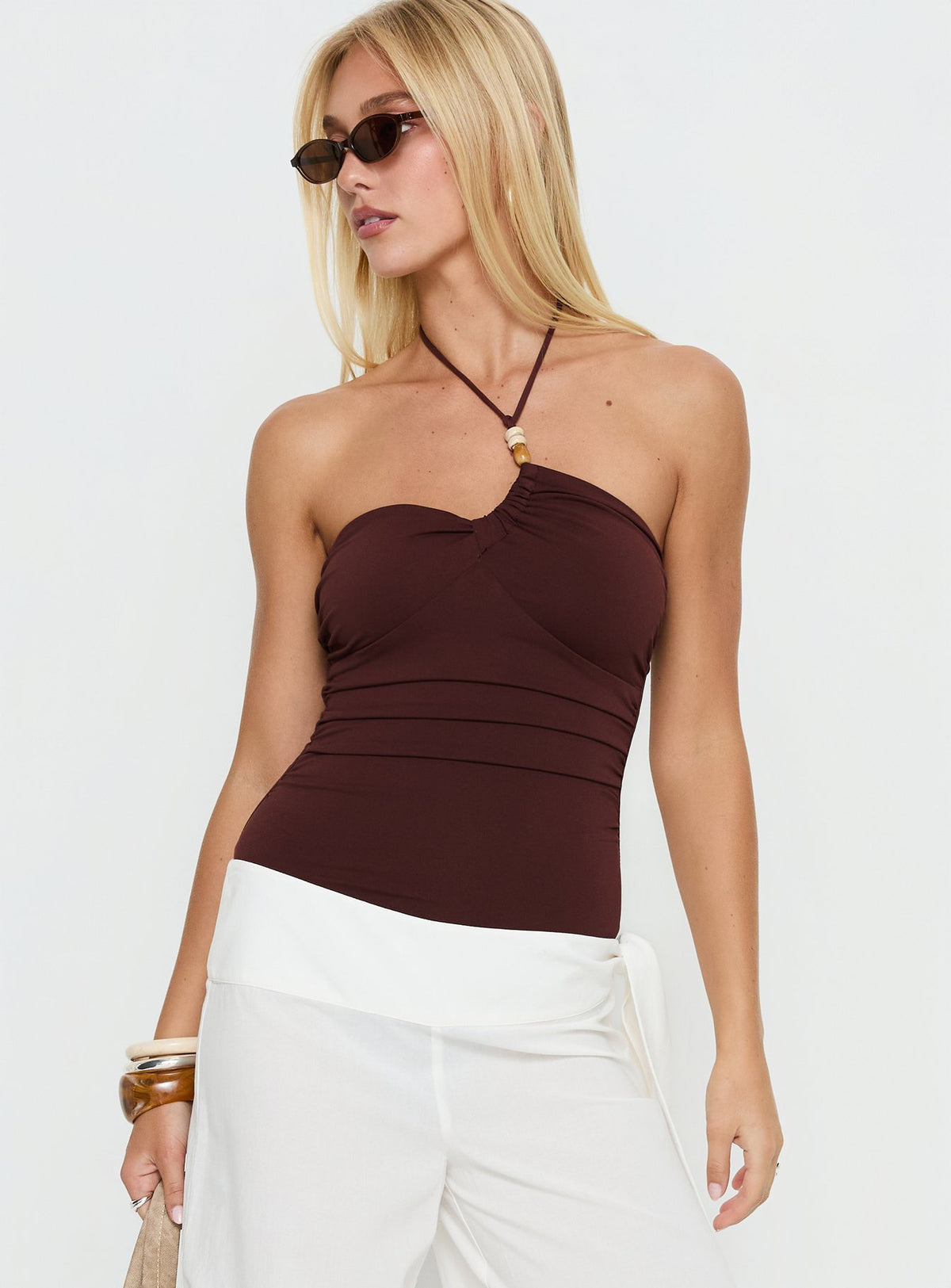 front view of model wearing Princess Polly Meda Bead Detail Ruched Bodysuit Brown Sleeveless Bodysuit 
