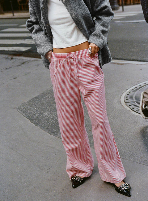 side view of model wearing Princess Polly Holiday Tie Front Pants Red/White Stripe Low Rise Pants Pants 