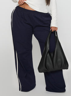 back view of model wearing Princess Polly Circuit Track Pants Navy Curve Pants 