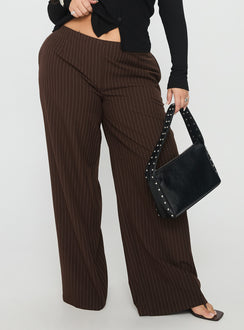 front view of model wearing Princess Polly Khane Low Rise Wide Leg Pant Brown Pinstripe Curve Low Rise Pants Pants 