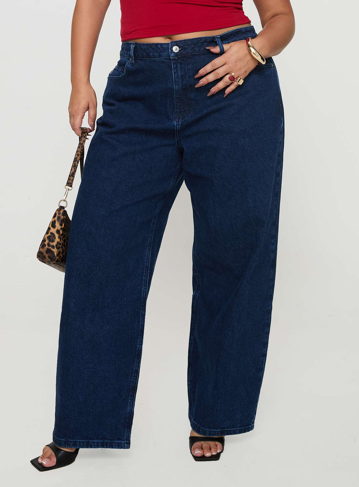 front view of model wearing Princess Polly Britta Mid Rise Tapered Leg Jeans Dark Wash Curve High Rise Jeans Jeans 