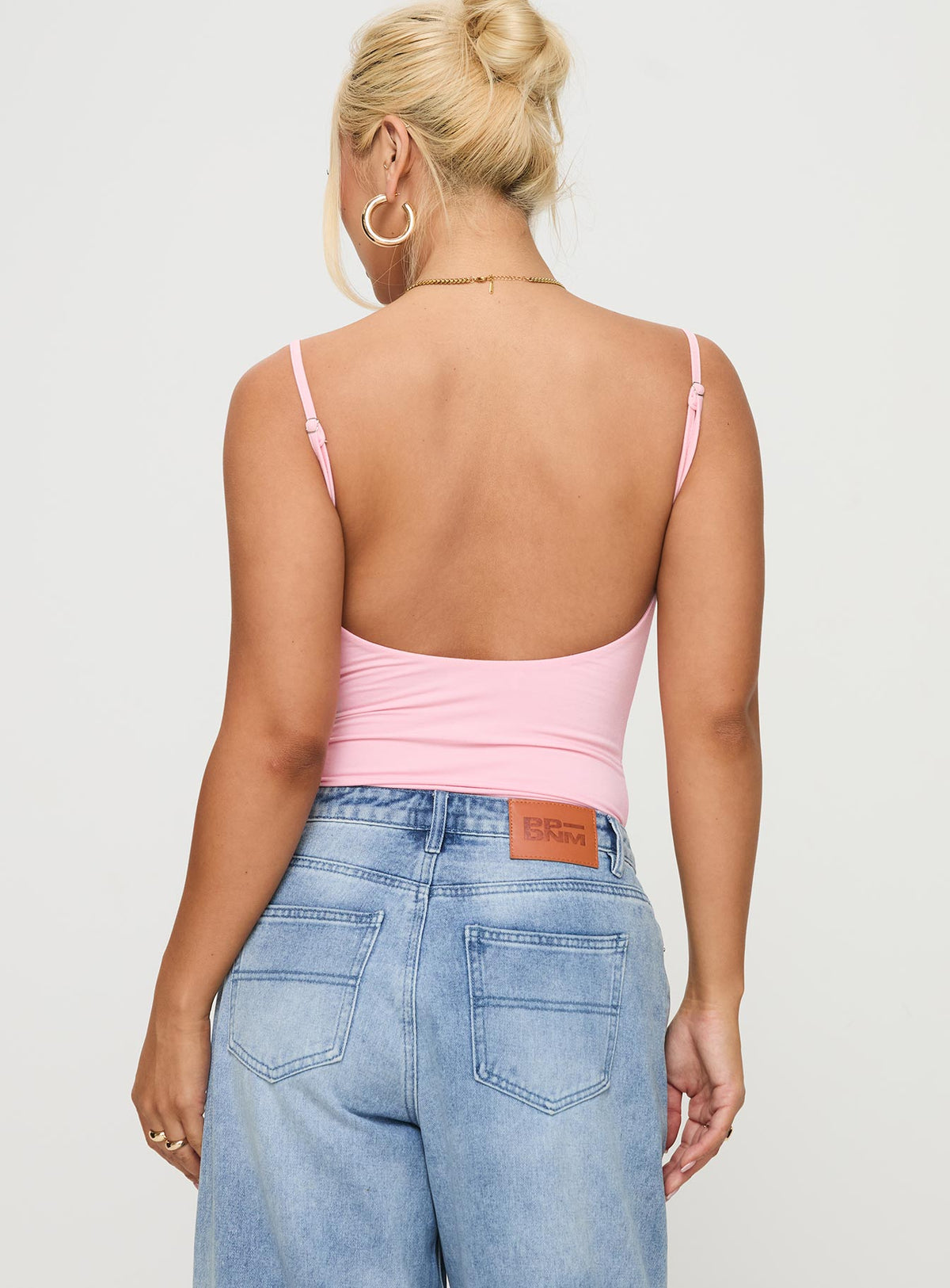 back view of model wearing Princess Polly Sweet Life Bodysuit Pink Sleeveless Bodysuit 