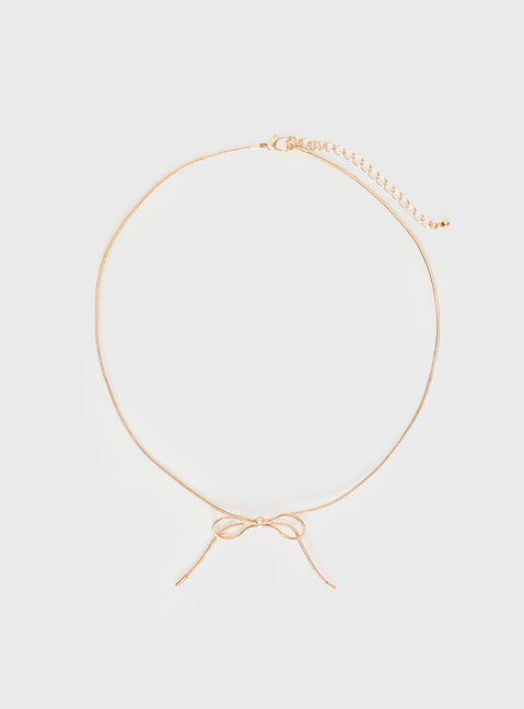 Gold-toned necklace Bow detail, lobster clasp fastening