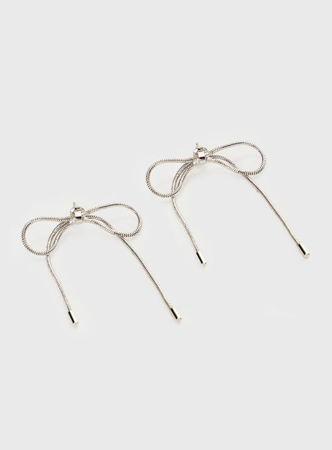 Silver-toned earrings Bow design, stud fastening