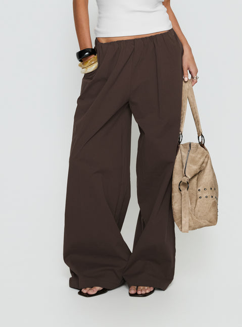 Crafted from the Lunea Concealed Waistband Pants Brown womens-regular-pants featuring mid-rise side view of model wearing Princess Polly