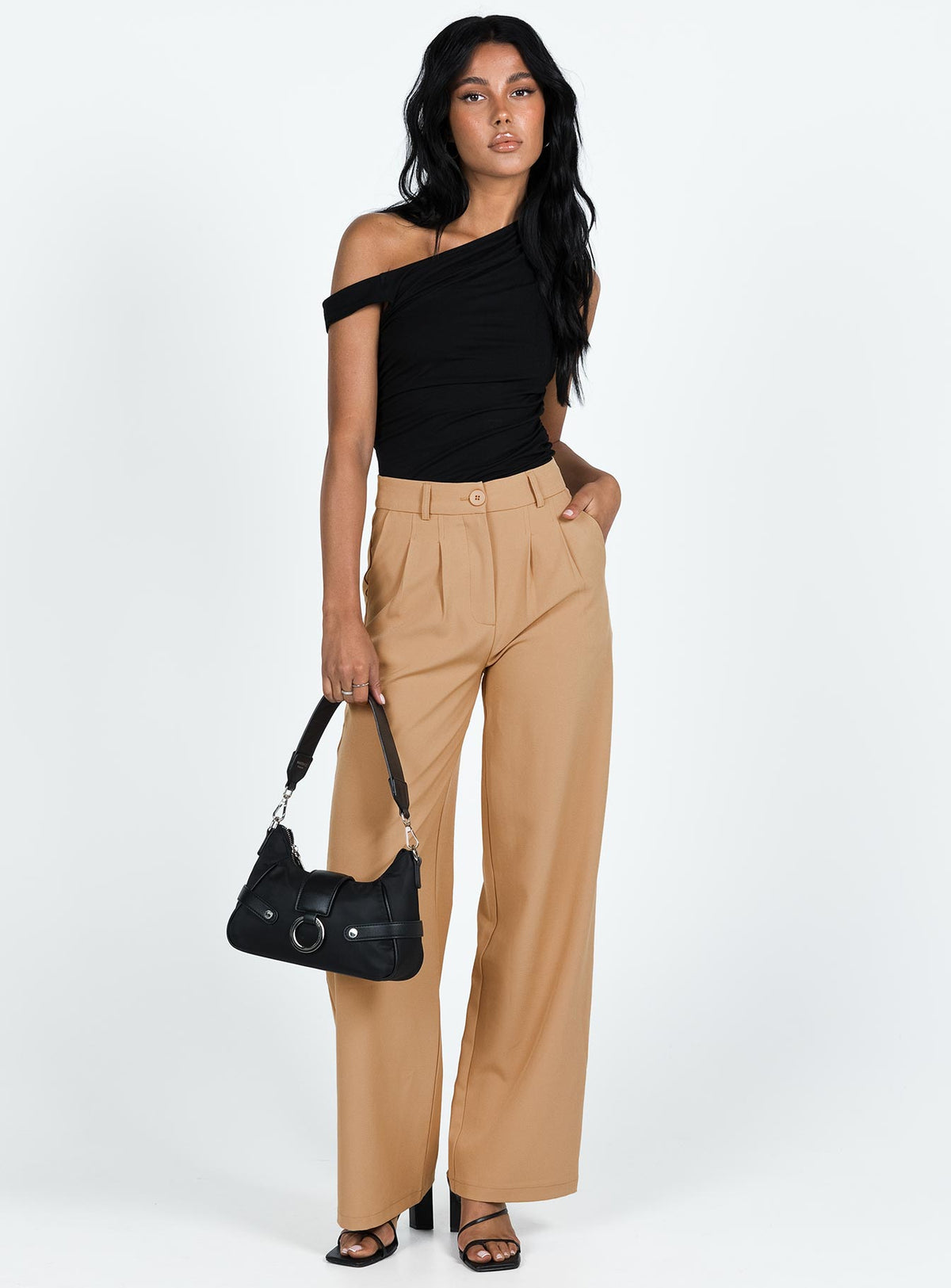 Front view of model wearing  front Princess Polly High Waisted Pants  Archer Pants Camel