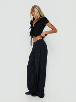 Discover Yuzima Micro Belt Pleated Pants Navy Pinstripe in womens regular pants with mid-rise side view of model wearing Princess Polly