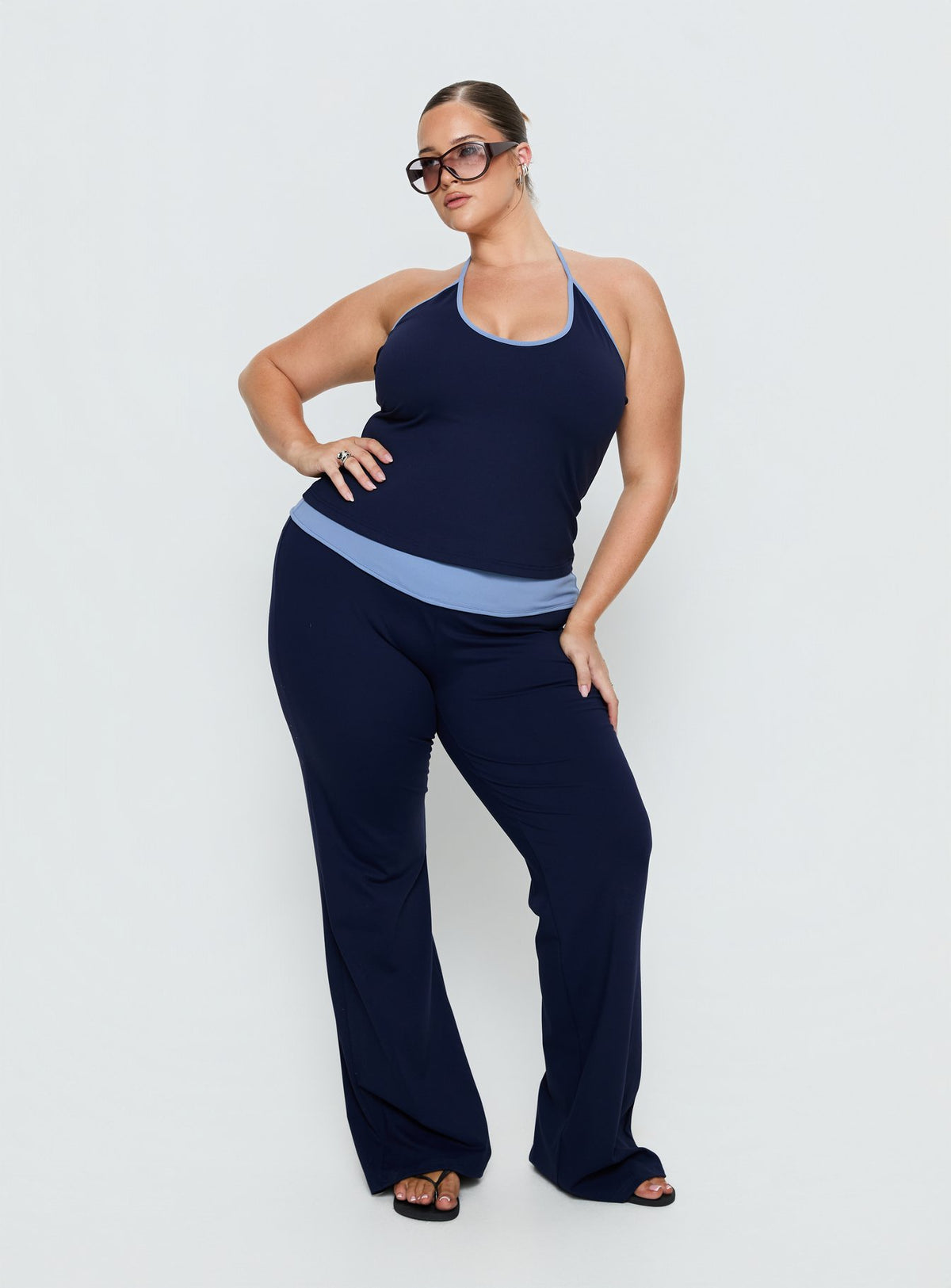 front view of model wearing Princess Polly Kobee Jersey Flare Pants Navy / Light Blue Curve High Rise Pants Pants 
