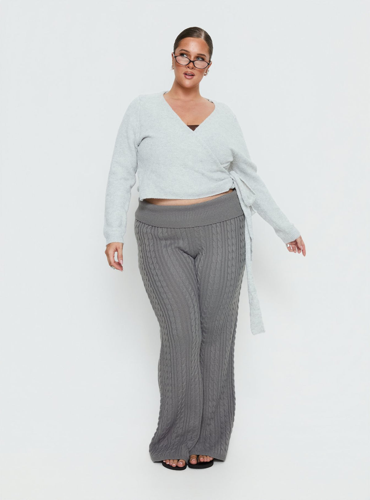 Crafted from soft knit the Tonee Wrap Cardigan Grey Curve in a short length womens jumper with v-neck and oversized fit on-body Princess Polly