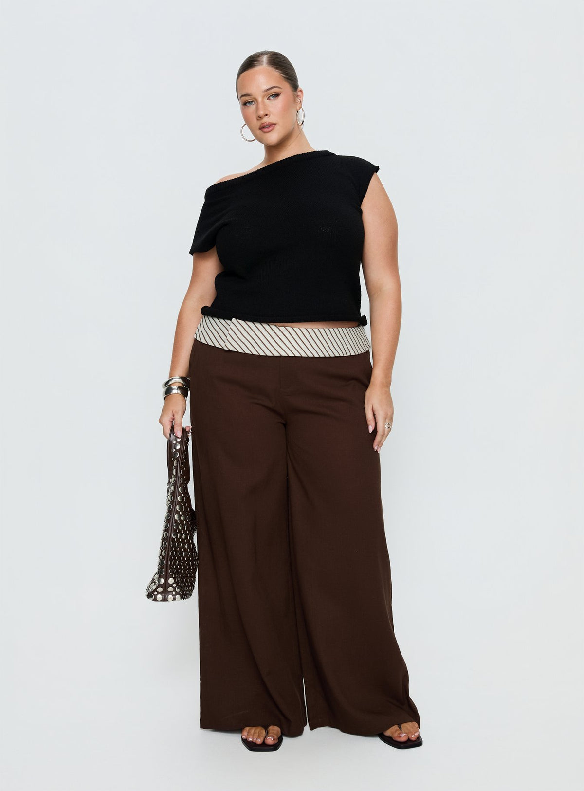 side view of model wearing Princess Polly Past Life Fold Over Waistband Pant Brown / Stripe Curve Mid Rise Pants Pants 