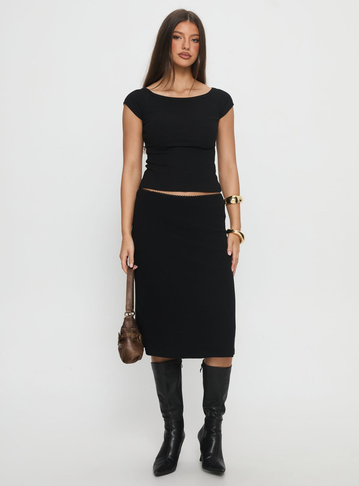   side view of model wearing Princess Polly Baseline Rib Midi Skirt Black Midi Skirts Skirts 