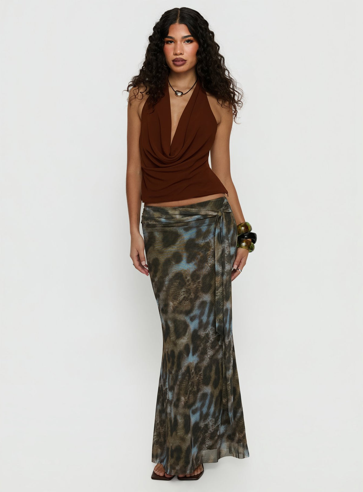   side view of model wearing Princess Polly Caviar Tie Maxi Skirt Leopard Skirts 