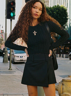   side view of model wearing Princess Polly Kinzlee Mini Skirt Black Tall Mini Skirts Skirts 