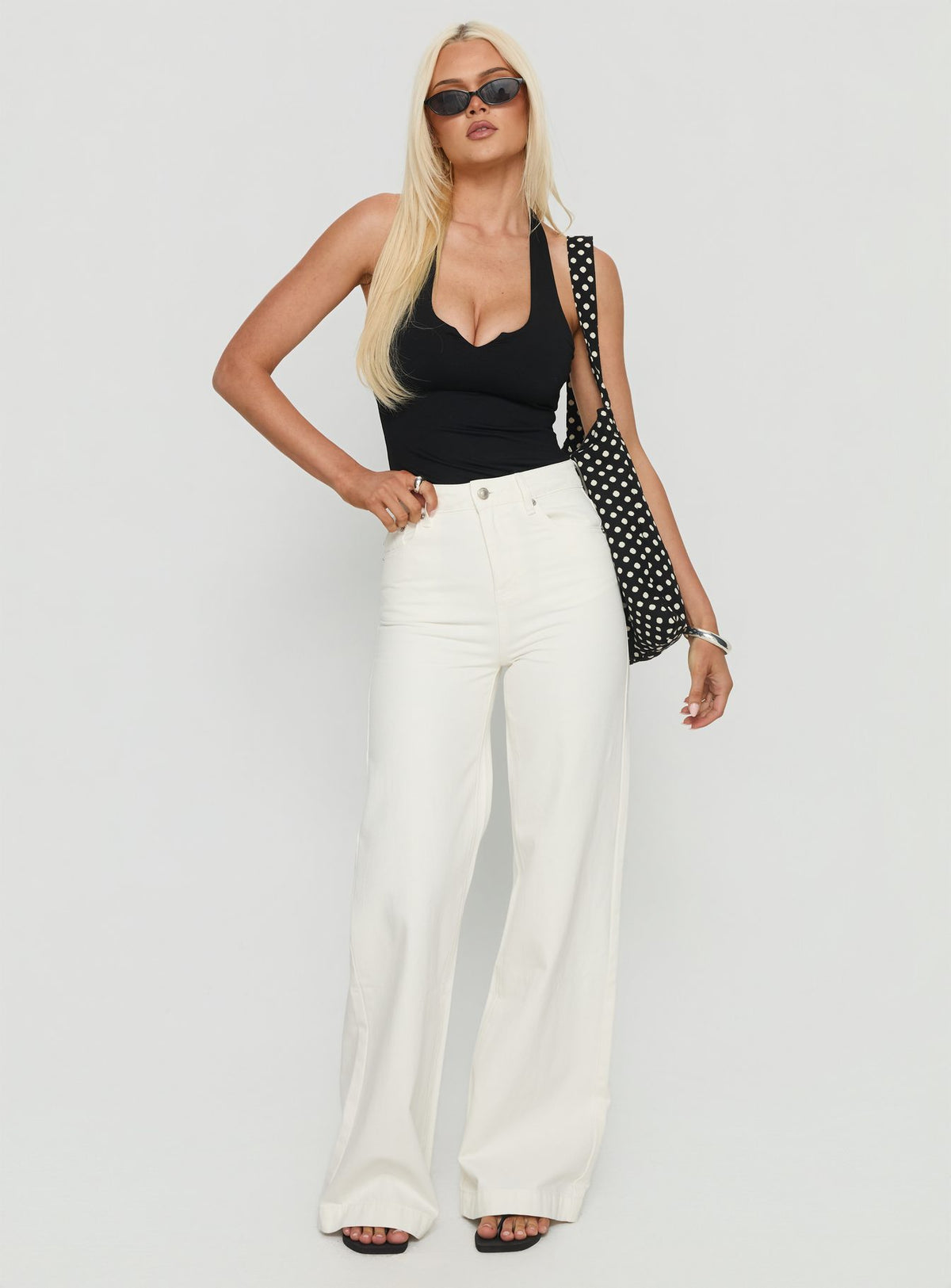 front view of model wearing Princess Polly Goldie High Rise Wide Leg Jeans White High Rise Jeans Jeans 