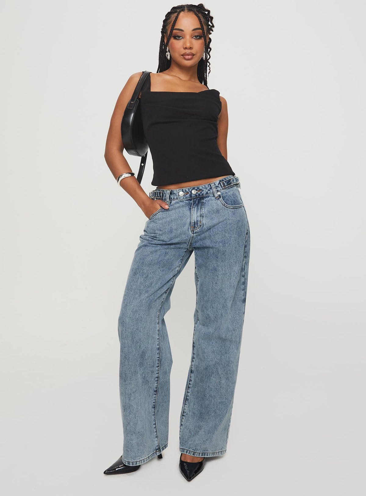 side view of model wearing Princess Polly Sidle Low Rise Straight Leg Jeans Light Wash Low Rise Jeans Jeans 