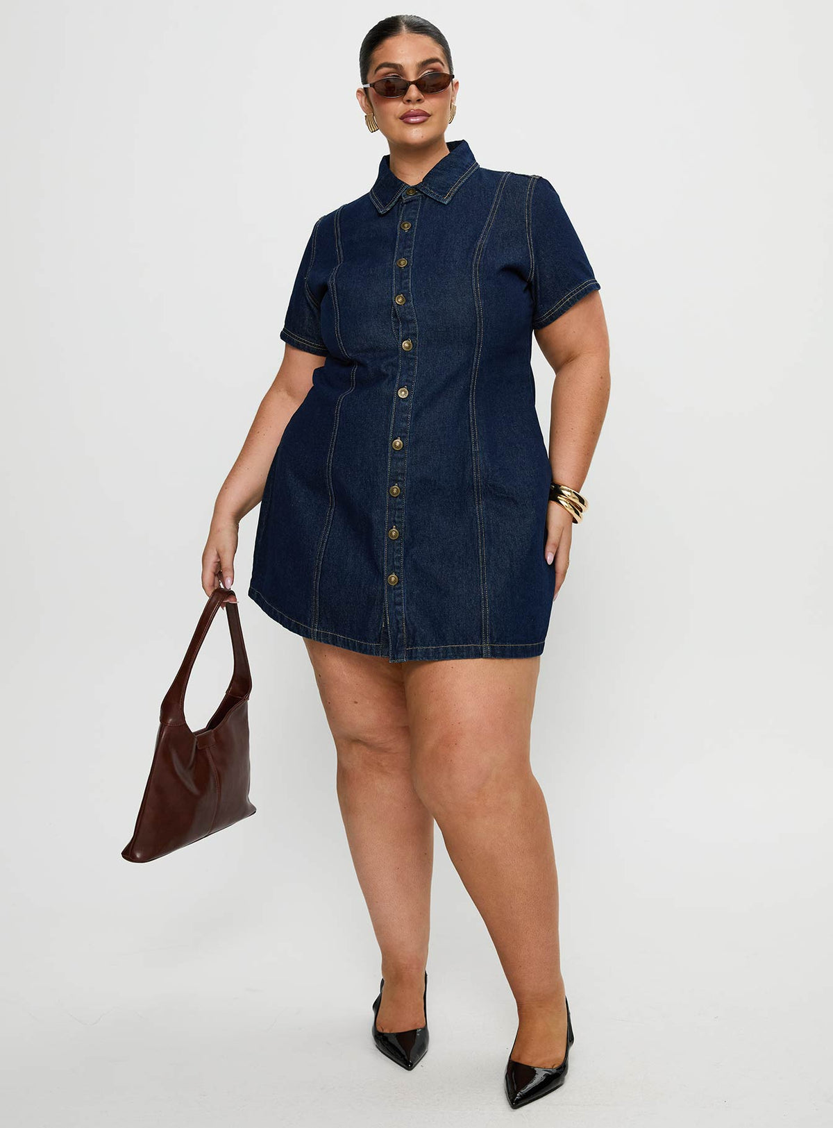 front view of model wearing Princess Polly Perception Denim Mini Dress Mid Wash Curve V-Neck 