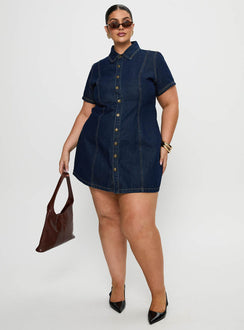 front view of model wearing Princess Polly Perception Denim Mini Dress Mid Wash Curve V-Neck 