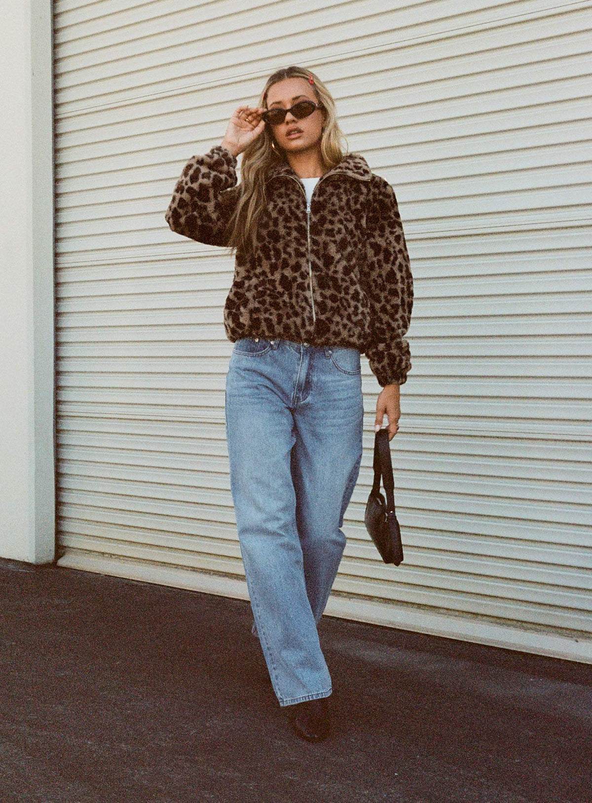 front view of model wearing Princess Polly Colemane Mid Rise Flared Jeans Angel Blue High Rise Jeans Jeans 