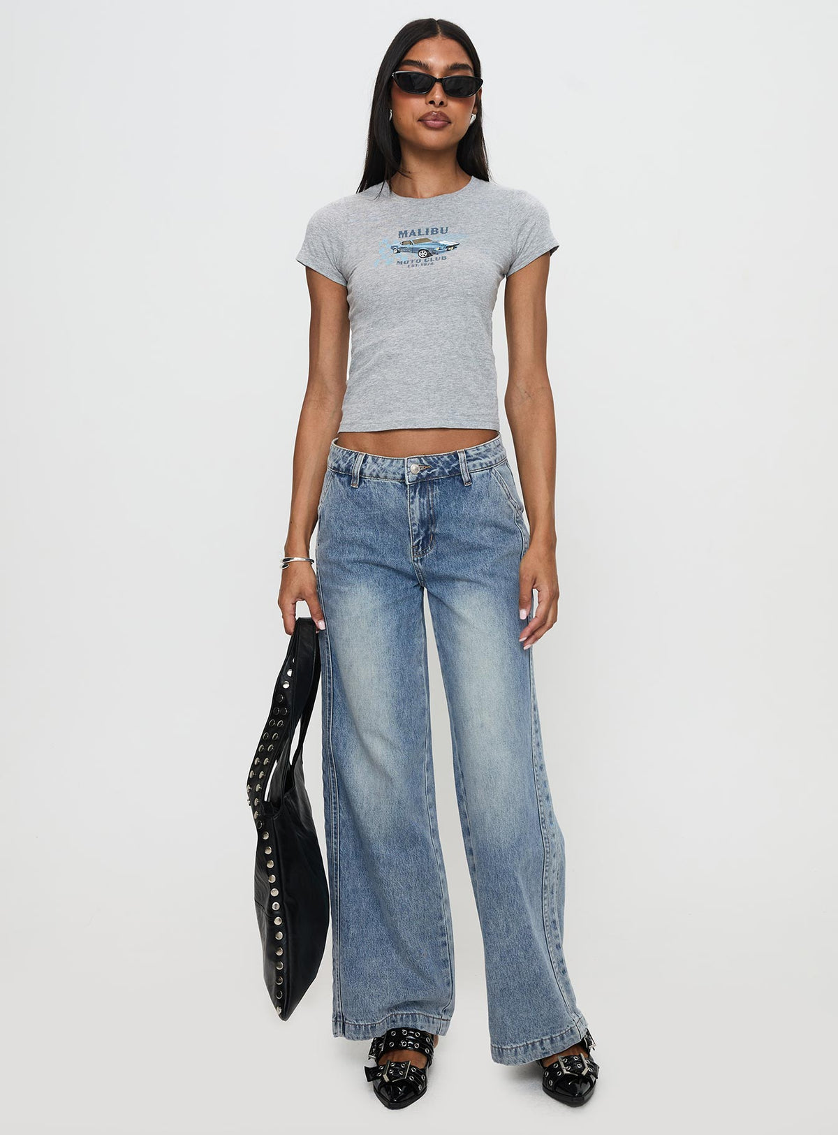 front view of model wearing Princess Polly Skipper Low Rise Wide Leg Jeans Vintage Blue Low Rise Jeans Jeans 