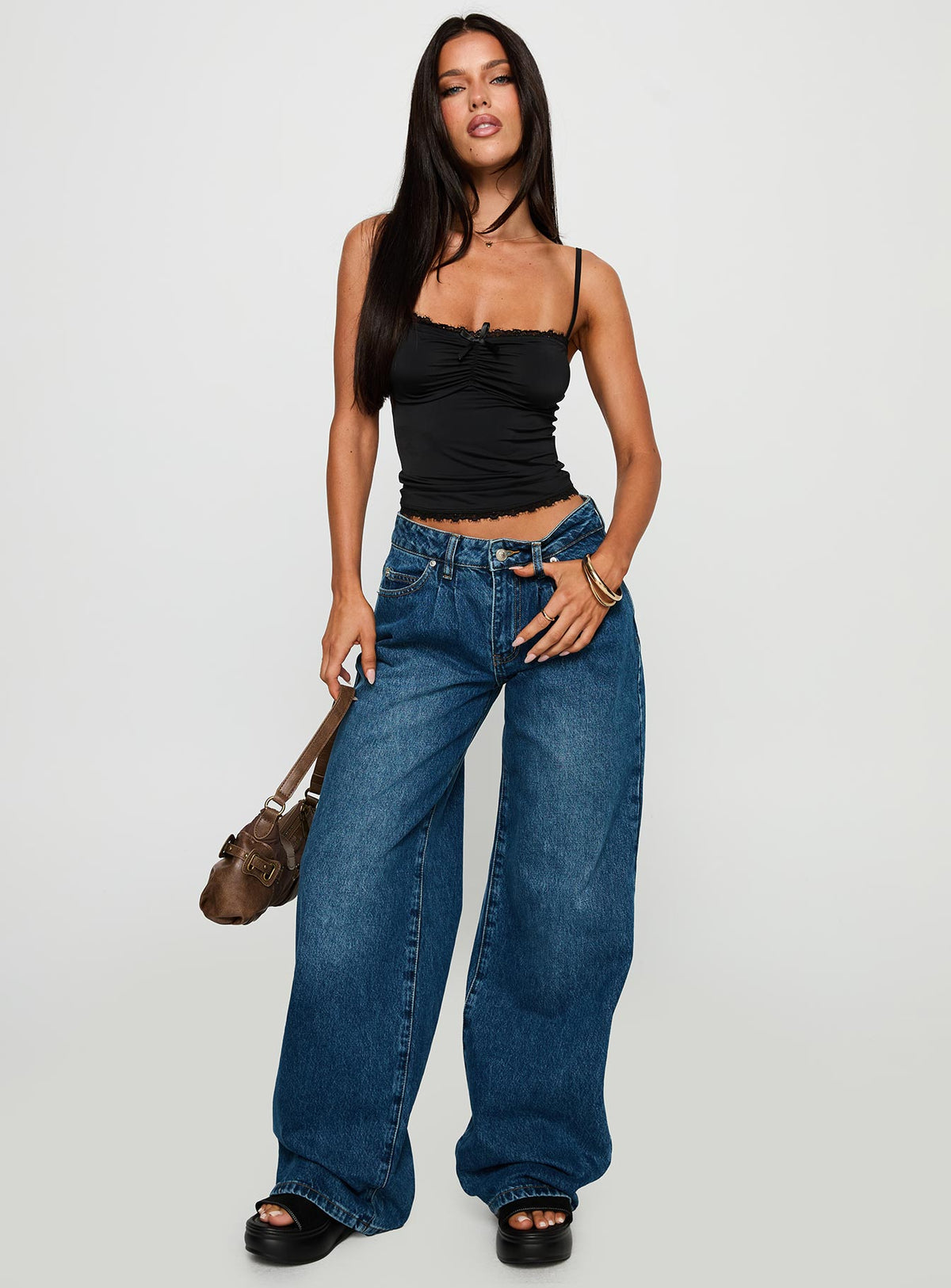 front view of model wearing Princess Polly Duster Mid Rise Baggy Jeans Dark Wash Mid Rise Jeans Jeans 
