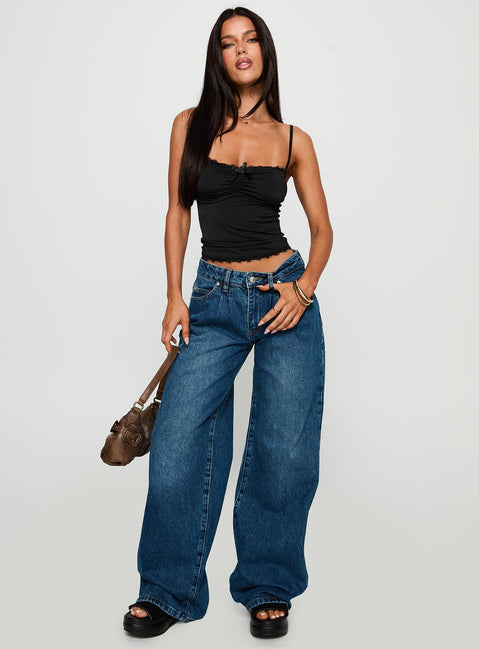 front view of model wearing Princess Polly Duster Mid Rise Baggy Jeans Dark Wash Mid Rise Jeans Jeans 