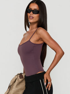 Featuring the Daily Define Thin Strap Low Back Bodysuit Aubergine in womens-bodysuit with sleeveless design side view of model wearing