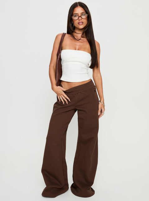 front view of model wearing Princess Polly Summits Flared Track Pants Chocolate High Rise Pants Pants 